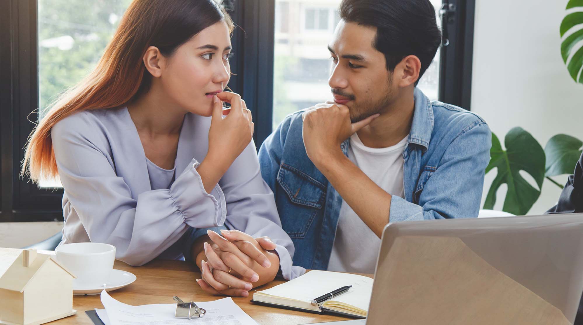 Financing your Columbus home: an image of a man and woman looking over their finances.